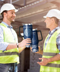 Two engineers holding a 40 Ounce Insulated Stainless Steel Tumbler With Handle And Straw For Engineers Built Tough Double Wall Coffee Cup