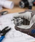 Heavy Duty 4 Set 3/4 Inch Cable Connectors For Electrical Conduit Fittings held in a gloved hand, featuring a zinc alloy design.