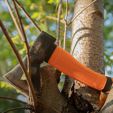 Compact Outdoor Camp Hatchet For Splitting And Kindling Wood With Forged Steel Blade resting against tree
