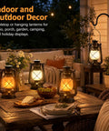 Waterproof Hanging Lanterns With Lit Dancing Flame LED Lights for Camping and Patio Decor on outdoor table and porch
