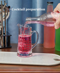 Glass Measuring Cup 5 Oz 150 Ml Shot Glass With V Spout And Insulated Handle being used for cocktail preparation