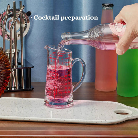 Glass Measuring Cup 5 Oz 150 Ml Shot Glass With V Spout And Insulated Handle being used for cocktail preparation