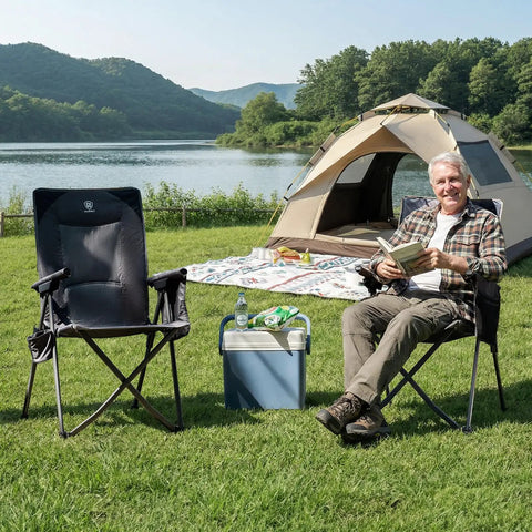 Man sitting beside Lightweight Folding Recliner Chair For Adults With 4 Position Adjustable Back Portable Lawn Chair in camping scene.