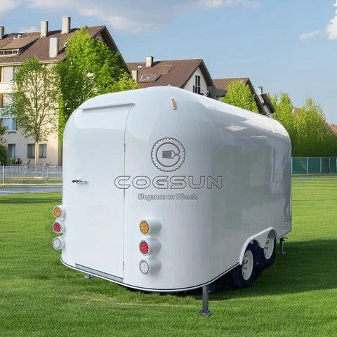 Custom Stainless Steel Food Truck Trailer With Turnkey Kitchen Setup For Mobile Coffee Or Hot Dog Business Built Heavy Duty To Level Up Your Street Vendor Hustle Today, viewed from the rear on grass.