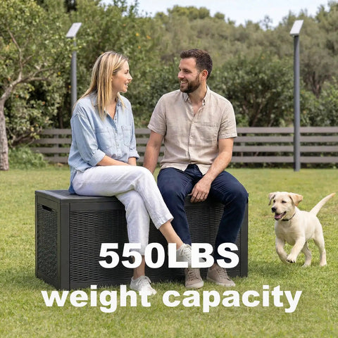 Couple sitting on 100 Gallon Resin Deck Box Lockable Outdoor Storage Chest, displaying 550 lbs weight capacity in garden setting.