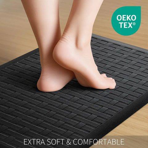 Bare feet on black cushioned mat, 2-Piece Cushioned Anti-Fatigue Kitchen Mats for Floor Waterproof Non-Slip Comfort Standing Rugs Built for Long Kitchen Shifts in Black 17.3x28 Inches Each