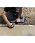 Person using Foam Concrete Kneeler Board With Extra Large Handles, Hard Bottom Padded Knee Pad For Concrete Finishing on fresh slab