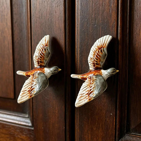 Two bird-shaped metal cabinet knobs on dark wood, Totally Cool Duck Shaped Metal Cabinet Knobs Set Of 2 Hand Painted Drawer Pulls.