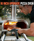 Man using 16 Inch Multi-Fuel Outdoor Pizza Oven For Wood Fired Or Gas Cooking Reaches 1112 Fahrenheit, Stainless Steel Portable Cooker