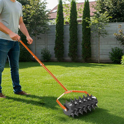 Man using Beast Heavy Duty 18 Inch Manual Lawn Aerator Roller with 49 Inch Adjustable Handle Spike Aerator for Deep Soil Penetration