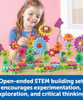 Child playing with Gear Up And Bloom STEM Flower Building Set For Kids 3 To 5, 116-piece gear garden kit on table.
