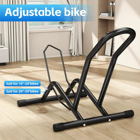 Heavy Duty Indoor Bike Floor Stand Adjustable Single Wheel Rack For Garage Ready Setup Fits 16 To 29 Inch Wheels And Up To Three Point Five Five Inch Tire Width Ideal For Mountain Road BMX And City Bikes shown on wooden floor indoors.