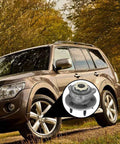 Car parked in forest with circular inset showing Front Wheel Hub Bearing Assembly for Ford Ranger and Mazda B4000 1998-2000 Front Disc Rear Drum 2-Wheel ABS, Also Fits Mazda 1998-2000 B3000 FWD, Drop-In Exact Fit, OE-Quality Replacement.