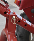 Close-up of red metal frame with hitch pin on 3 Point Post Hole Digger For Tractors With 6 Inch Auger Fits Compact And Sub Compact Cat 0 Tractors Beefy Right Angle Gearbox PTO Driveline Safety Shields A Frame Lift Arm 21 Inch Spacing Hardware Kit Included