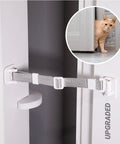 Close-up of Upgraded Cat Door Latch and Stopper Adjustable White Pet Gate with a cat peeking from behind a door.