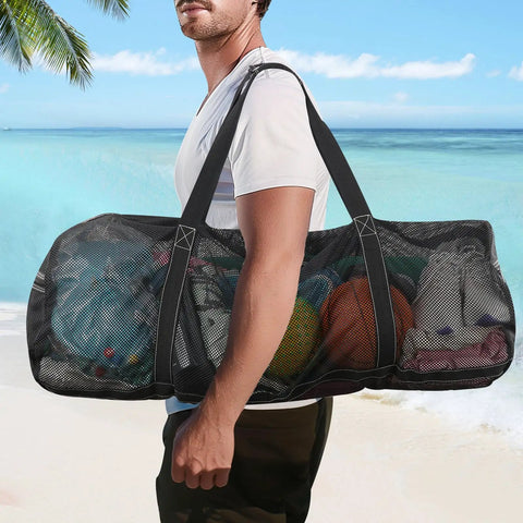 Person carrying Oversized Mesh Dive Bag Duffle For Scuba Gear With Shoulder Strap And Carabiner Keychain on beach