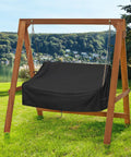 Waterproof Porch Swing Cover For Outdoor Patio Swings Garden Hammock Gliders And Hanging Benches Size 62 By 26 By 15 To 21 Inches Made From 420D Oxford Fabric With Sealed Seams For All Weather Protection And Easy Fit, shown on wooden swing frame.