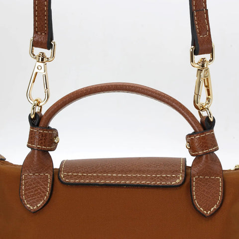 Hella Sturdy Adjustable Cowhide Leather Shoulder Strap Kit With Vintage Gold Hardware for purse installation, showing brown leather and gold clasps.