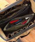 Interior view of an open Heavy Duty Tool Pouch Set Large 12 Inch Zipper Bags with tools inside, showcasing rugged canvas and YKK zippers.