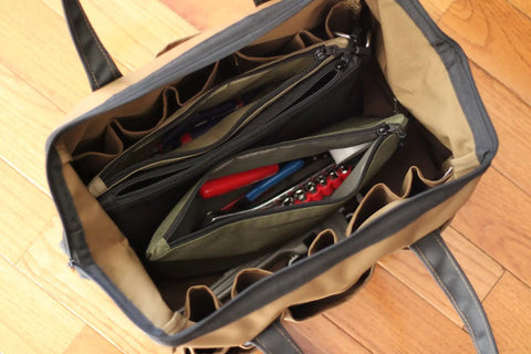Interior view of an open Heavy Duty Tool Pouch Set Large 12 Inch Zipper Bags with tools inside, showcasing rugged canvas and YKK zippers.