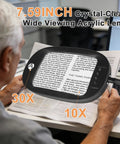 Man reading newspaper with Upgraded 30X And 10X Floor Magnifying Glass With Light And Stand Hands Free 3 In 1 Magnifying Lamp