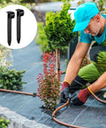 Gardener using Pack Of 100 Half Inch Irrigation Tubing Hold Down Stakes Beefed Up Heavy Duty Anchors For Sprinkler Garden Landscaping Drip Lines Three Quarters Inch By Four Point Three Three Inch in landscape scene