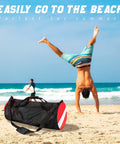 Oversized Mesh Duffle Bag For Diving And Beach Gear on sand with beachgoers in background, Monster 100L Capacity
