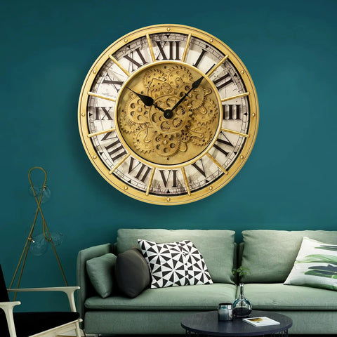 18 Inch Big Boy Gear Wall Clock With Smooth Rotating Cogs And Crisp Gold Roman Numerals mounted on a blue wall above a green couch.