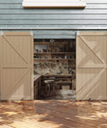 16 Foot Box Rail Exterior Barn Door Hardware Kit for Two Doors System installed on wood wall, doors open to workshop view