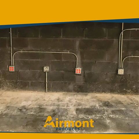 Installed 4 Inch Square Electrical Box and 2 Gang Duplex Receptacle Exposed Work Cover Pack with Crushed Corners.