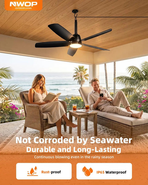 36 Inch Outdoor Ceiling Fan With Light And Remote, wet rated, installed on patio with two people seated, ocean view in background