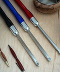 Top-down view of four 12-inch aluminum lathe turning tool handles with color-coded grips and blades.
