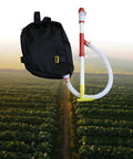 Backpack Sprayer And Manure Distributor For Vegetables With PVC Tube Handy Workhorse For Farm Or Garden against field backdrop