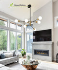 Sputnik Chandelier Pendant Light Black And Gold, Mid Century Modern Industrial E26 Ceiling Fixture in living room with sloped ceiling