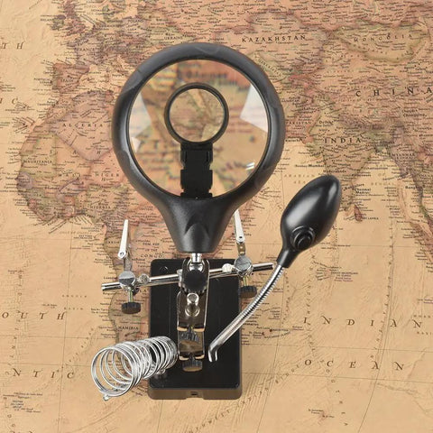 LED Light Magnifier Desk Lamp With 2.5X, 7.5X And 10X Lenses on vintage map background, showing clamp and alligator clip stand