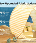 Pop Up Baby Beach Tent With 2026 Upgraded UV Protection Lightweight Portable Sun Shelter For Babies with pastel stripes on beach.
