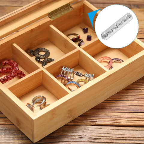Smooth Like Butter Small Piano Hinge Kit For Jewelry Boxes shown in a wooden ring storage box with silver hinges.