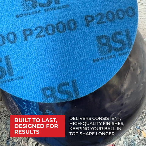 Close-up of 1000 Grit Bowling Ball Sanding Disc Kit for Resurfacing Machines Ball Spinner and Hand Cleaning on a bowling ball.