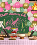 Camp Bachelorette Balloon Garland Arch Kit With Sage Green Backdrop And Sash For Lake Hiking Bridal Shower And Engagement Party Decor Including 50 12 Inch Balloons, 20 5 Inch Balloons, Diamond Ring Foil Balloon, Flame Centerpiece with a picnic table display.