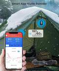 2-In-1 Indoor Outdoor Thermometer Hygrometer With IP65 Waterproof Rating hanging in a tent, showing Bluetooth connection to smartphone app.