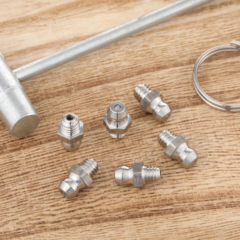 Six Pack Stainless Steel M6 X 1mm Straight Grease Fittings Zerk Nipples For Hydraulic Gear And Machinery on wooden surface