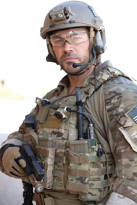 Military personnel wearing helmet with Sidewinder 55 Lumen LED Military Flashlight With Two AA Batteries Go To Helmet And MOLLE Mount.