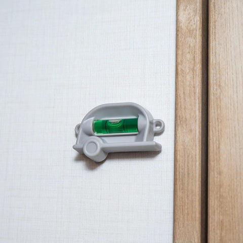 Retro RV Leveling Pack with front to back and side to side on point precision mounted on wall with camper design.