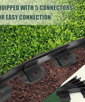 1.5 Inch Tall Landscape Edging 100 Ft No Dig Garden Border in Black with 5 connectors and 120 anchoring spikes shown in grass