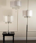 Moiselle Swanky Modern Table Lamp With Chrome Finish, Double Drum Shade in Sheer Off White displayed on side table