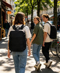 People walking with Carry On Friendly Hiking Backpack With Expandable Capacity Opens Flat For Easy Packing At Security