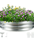 Four Foot Diameter Camp Fire Ring Pit Made From Galvanized Steel, Large Round Heavy Duty Fire Pit In Silver, shown with flowers