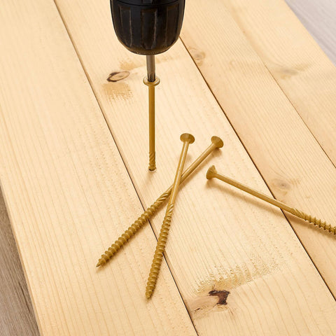 Drill inserting 5-inch deck screw through wood, showcasing 50 Pc Deck Screws Set, 5 Inch #10 Self Drilling Wood Screws With Rust Resistant Coating