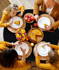 Round Fitted Tablecloth With Elastic Edge, 100 Percent Waterproof Plastic Cover, Vinyl Flannel Backed Table Protector For Indoor Outdoor Use, Snug Fit Wont Slip On 45 To 56 Inch Round Tables, Black, with people dining.