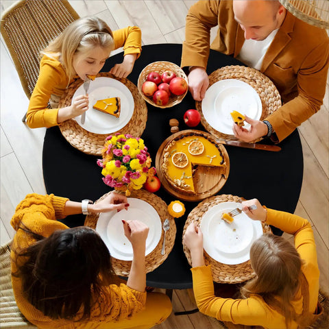 Round Fitted Tablecloth With Elastic Edge, 100 Percent Waterproof Plastic Cover, Vinyl Flannel Backed Table Protector For Indoor Outdoor Use, Snug Fit Wont Slip On 45 To 56 Inch Round Tables, Black, with people dining.
